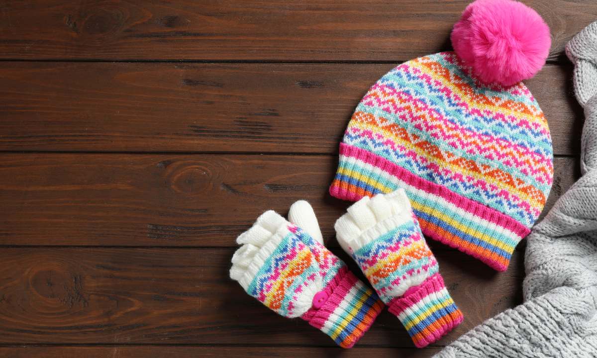 Bimbi e inverno: trucchi per far tenere cappello, sciarpa e guantini